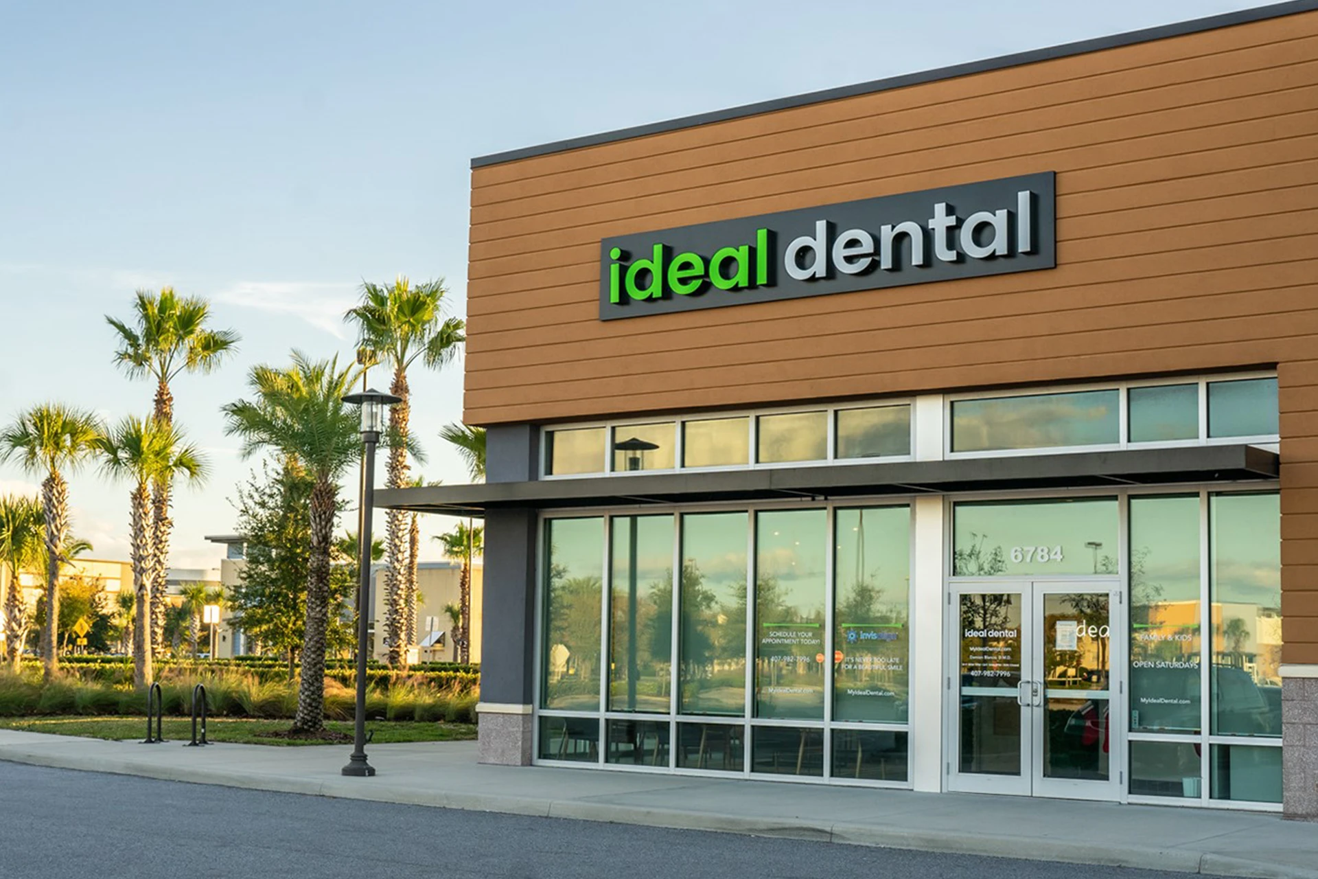 Ideal Dental Lee Vista office building with palm trees